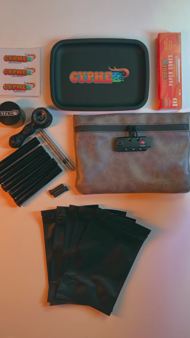 26 Piece Smell Proof Smoking Kit - with all the essentials.  Perfect as a starter kit or gift set  Features:      Lock for privacy and security : Zippers lock into built in combination lock to ensure privacy and safety. Included tag explains how to set and reset your 3 digit code.      Travel: The bag is lightweight and easy for travel. The slim profile of the bag makes it easy to store in a backpack, briefcase, or pocketbook